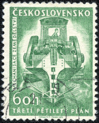 Stamp shows image of ditch digging machine