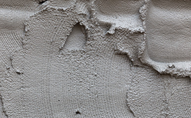 plasterer concrete on wall of house construction