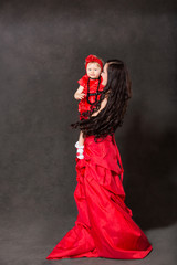 Happy mom and child girl hugging and laughing