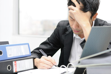 Thoughtful or stressful businessman at work © tigger11th