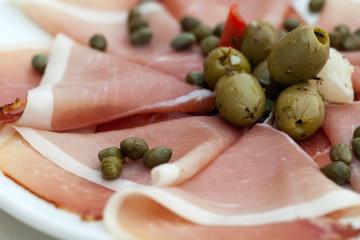 Prosciutto with olives and caper