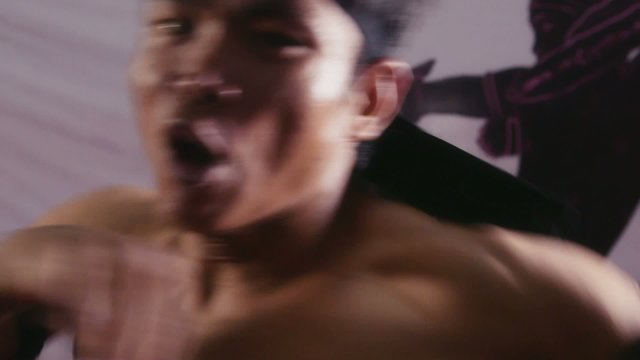 11of20 Asian man training kickboxing in gym as fighter