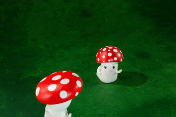 two cute puppets handmade, green background