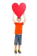 boy holding up red heart shape