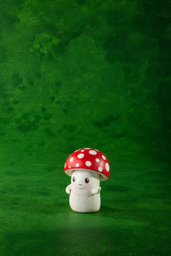 cute puppet handmade, one mushrooms, green background