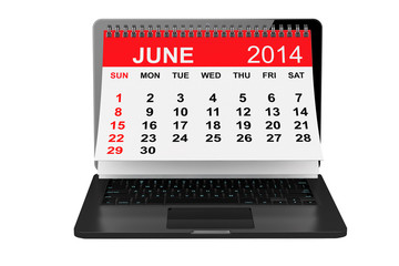 June calendar over laptop screen