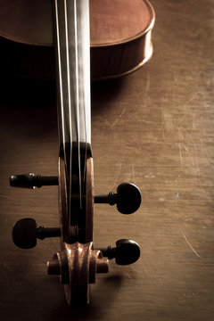 Violin neck on wooden table