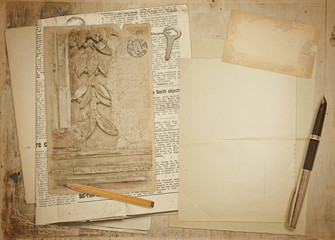 Vintage background with old newspaper, card and sheets of paper