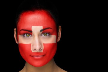 Composite image of swiss football fan in face paint