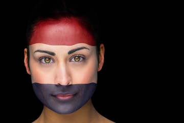 Composite image of netherlands football fan in face paint