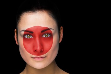 Composite image of japan football fan in face paint