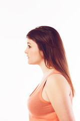 Young woman posing in studio, profile
