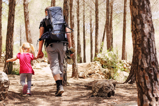 Father hiking with kid