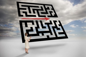 Composite image of thinking businesswoman