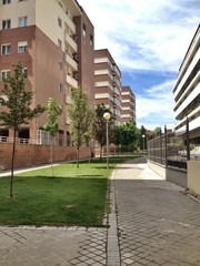 buildings, grass and sidewalk