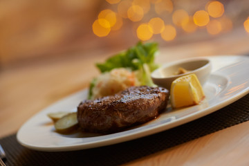 steak with sauce and vegetables
