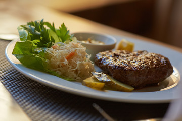 steak with sauce and vegetables