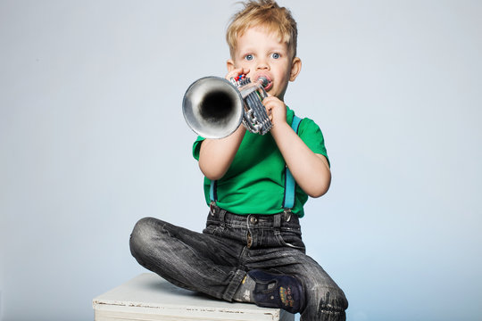 Child Blowing Trumpet