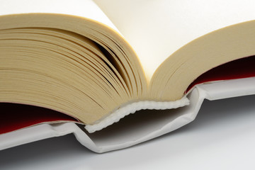 Macro detail of a big white book on white background