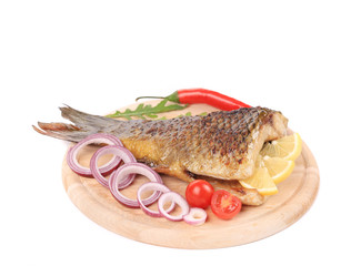Grilled fish with vegetables.