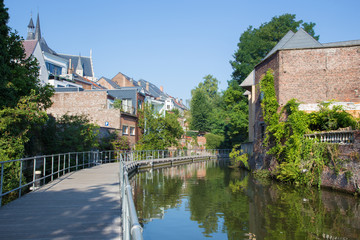 Fototapeta na wymiar Mechelen - Canal and Church of Our Lady across the Dyle