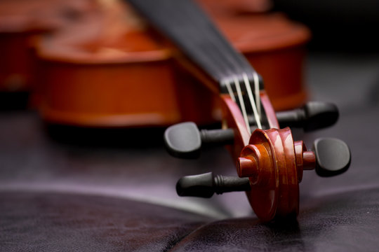 Classic old violin vintage on the leather background