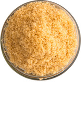 Brown sugar in a glass container over white background