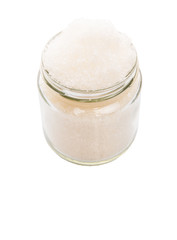 White refine sugar in a glass container over white background