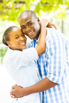 young black couple hugging