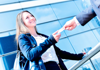 Junior executives dynamics exchange their business cards