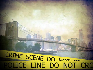 Police line do not cross sign tape on view of Brooklyn bridge