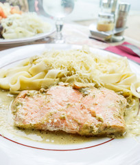 plate of pasta and smoked salmon with tomato