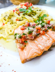 plate of pasta and smoked salmon with tomato