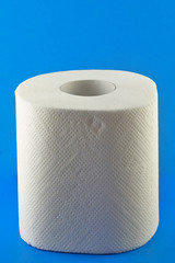 Toilet paper on blue