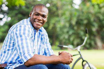 Naklejka na ściany i meble african man relaxing at the park