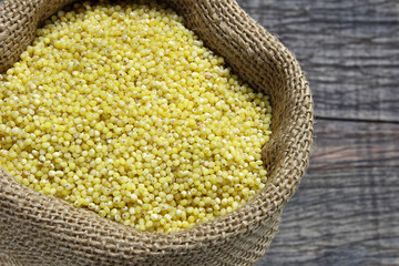 Raw millet in canvas sack