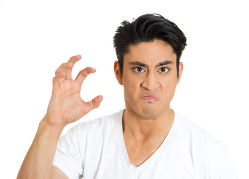 The claw. Portrait of angry, mad young man on white background 