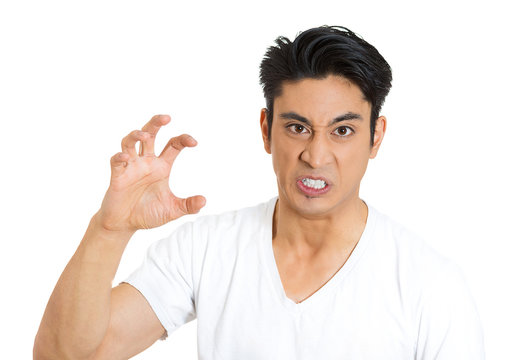 The claw. Portrait of angry, mad young man on white background 