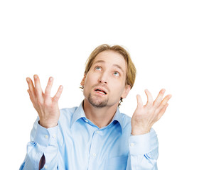 Help, why me? Stressed middle aged man looking up
