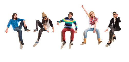 Group of happy people sitting on a big banner