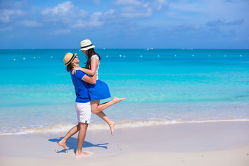 Fototapeta na wymiar Young happy couple have fun on Caribbean vacation