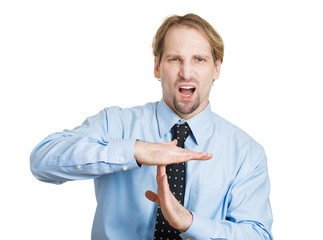 Business man giving time out gesture