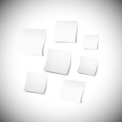 white note papers with shadow on gray background
