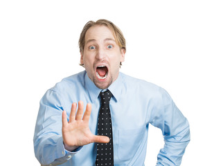 Portrait business man screaming stop, afraid of consequences 