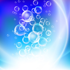 Group of transparent spheres on a blue background