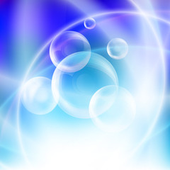 Group of transparent spheres on a blue background
