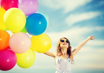 Obraz na płótnie Canvas happy girl with colorful balloons