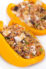 Quinoa chicken stuffed peppers over white background