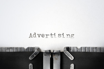 "Advertising" written on an old typewriter
