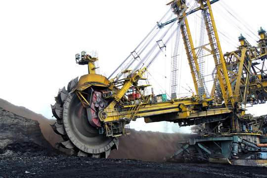 huge yellow  coal excavator in action